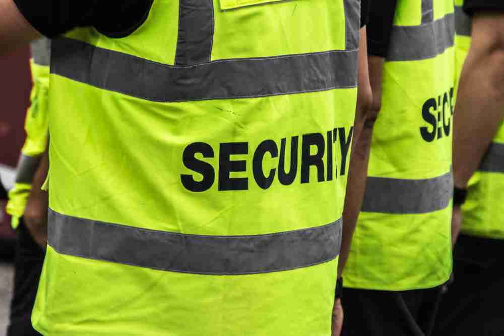 Close up of security guard high vis tabard