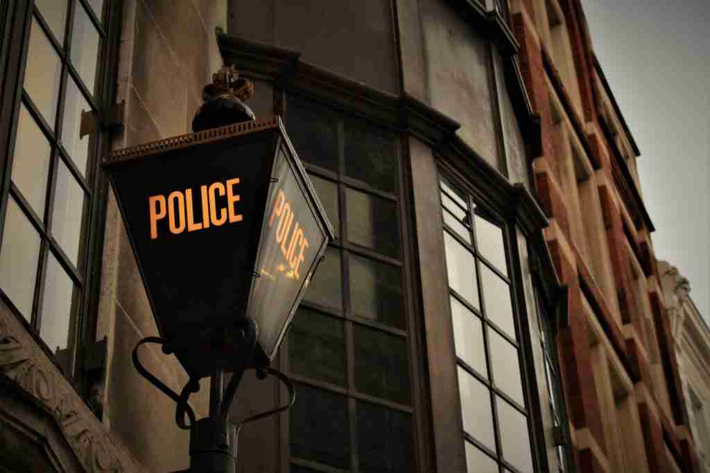 Police sign outside station in London