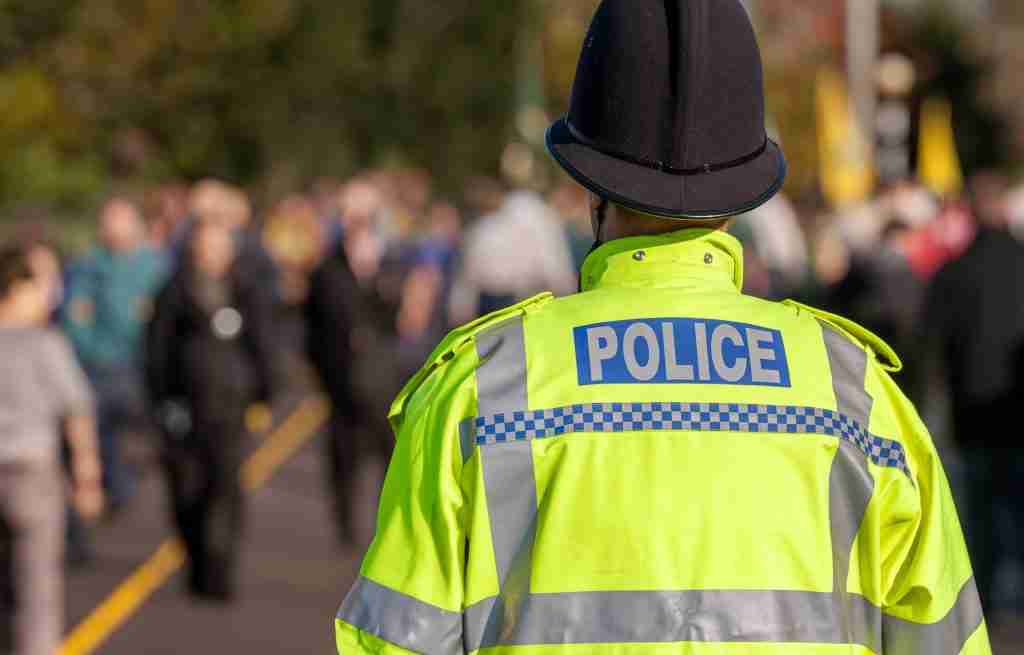 Police Officer seen from the back in uniform