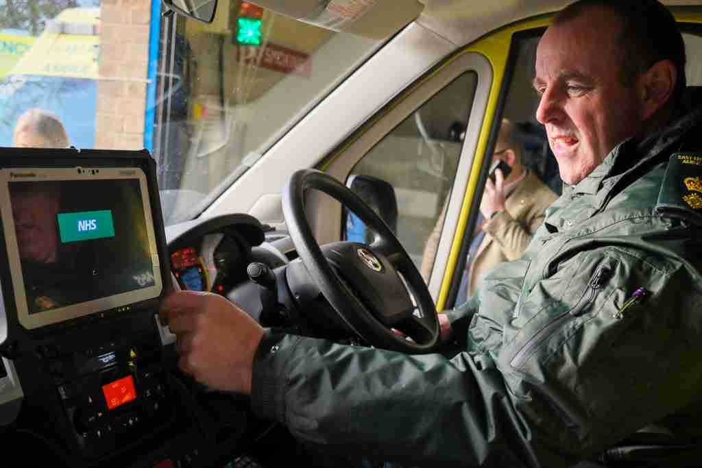 Paramedic inside ambulance with new communications technology installed