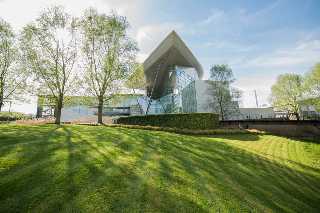View over grass of the HQ for the Met Office in Exeter.
