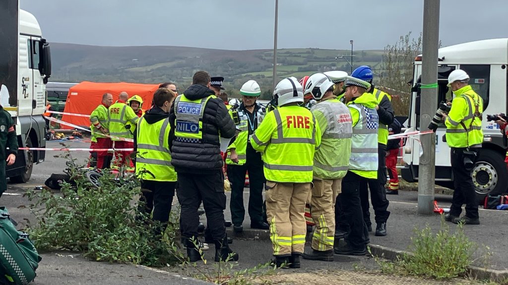 Incident commanders in a huddle at a multi-agency training exercise in South Wales.