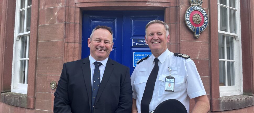 PFCC David Allen(left) and CC Darren Martland stand outside a police station in Cumbria.