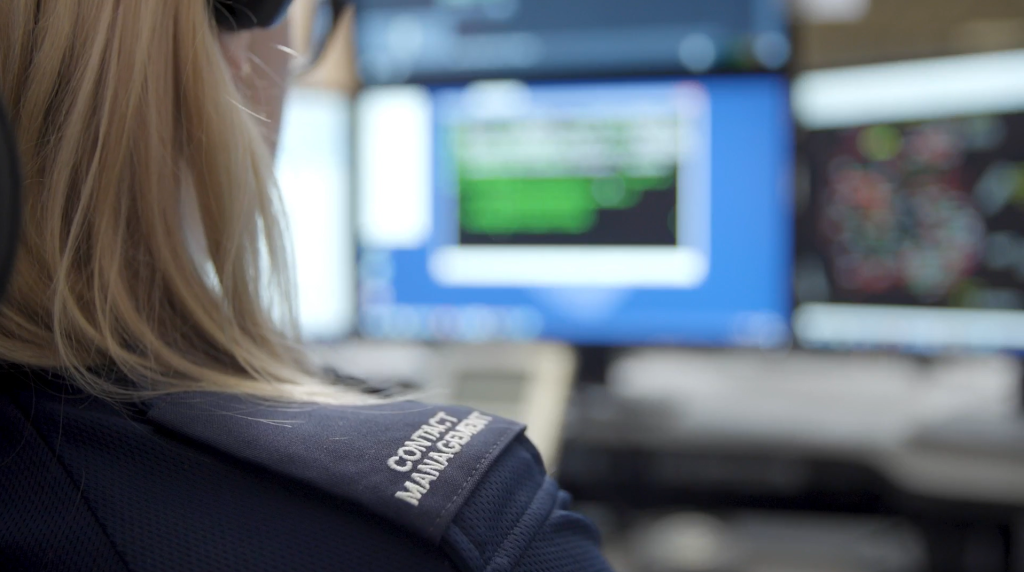 Control room officer shown side on with epaulette in focus.