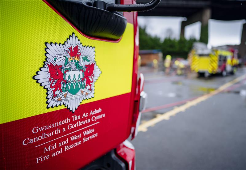 Mid and West Wales Fire and Rescue logo.