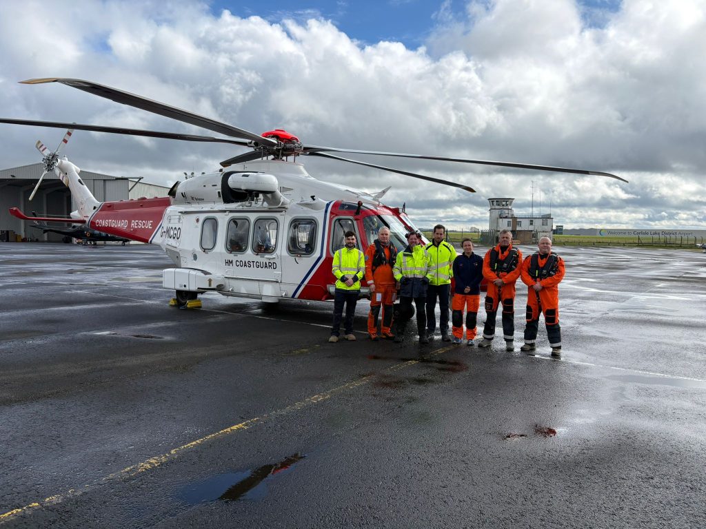 Crews with new helicopter at Carlisle seasonal search and rescue base.