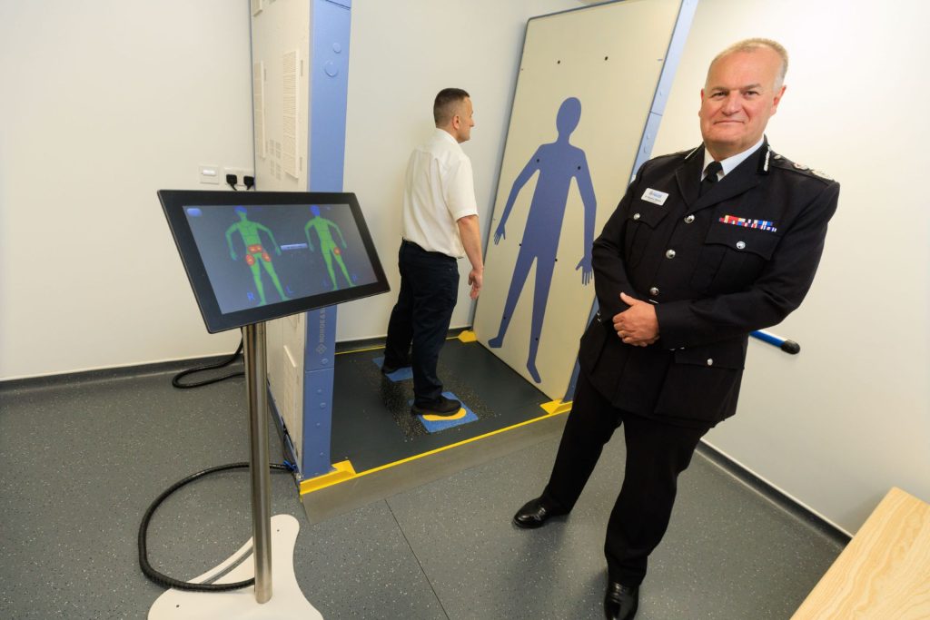 Chief Constable Sir Stephen Watson next to the airport-style scanner