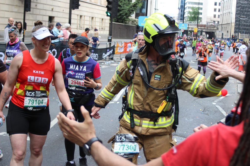 Firefighter Steve Behan in full fire kit running the London Marathon 2026.